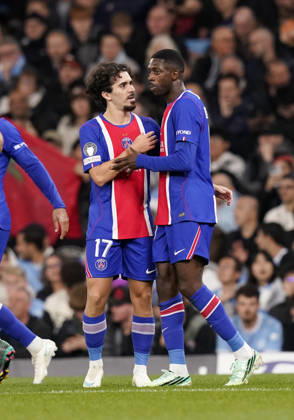 Manchester, England, 14th October 2026. Vitinha of Paris Saint-Germain and Dembele Ousmane of Paris Saint-Germain celebrate scoring the second goal during the Manchester City vs Paris Saint Germain UEFA Champions League match at the Etihad Stadium, Manchester. Picture credit should read: Andrew Yates Sportimage EDITORIAL USE ONLY. No use with unauthorised audio, video, data, fixture lists, club league logos or live services. Online in-match use limited to 120 images, no video emulation. No use in betting, games or single club league player publications. SPI_029_AY_Man_City_PSG SPI-5069-0034