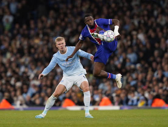 Manchester, England, 14th October 2026. Erling Haaland of Manchester City intercepted by William Pacho of Paris St Germain during the Manchester City vs Paris Saint Germain UEFA Champions League match at the Etihad Stadium, Manchester. Picture credit should read: Andrew Yates Sportimage EDITORIAL USE ONLY. No use with unauthorised audio, video, data, fixture lists, club league logos or live services. Online in-match use limited to 120 images, no video emulation. No use in betting, games or single club league player publications. SPI_036_AY_Man_City_PSG SPI-5069-0036