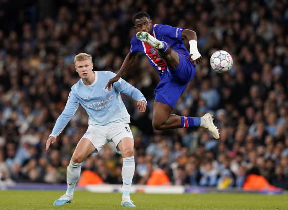 Manchester, England, 14th October 2026. Erling Haaland of Manchester City intercepted by William Pacho of Paris St Germain during the Manchester City vs Paris Saint Germain UEFA Champions League match at the Etihad Stadium, Manchester. Picture credit should read: Andrew Yates Sportimage EDITORIAL USE ONLY. No use with unauthorised audio, video, data, fixture lists, club league logos or live services. Online in-match use limited to 120 images, no video emulation. No use in betting, games or single club league player publications. SPI_037_AY_Man_City_PSG SPI-5069-0037