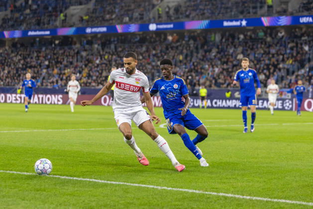 Josha Vagnoman of VfB Stuttgart and Suleiman Camara of SK Slovan Bratislava seen during UEFA Champions league League phase game between teams of SK Slovan Bratislava and VfB Stuttgart (Dominika Kortvelyesiova Ball Raw Images) Bratislava Tehelne Pole stadium Slovakia Copyright: xDominikaxKortvelyesiovax DKOR6642