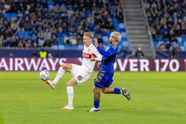 Chris Fuhrich of VfB Stuttgart and Cristian Martinez of SK Slovan Bratislava seen during UEFA Champions league League phase game between teams of SK Slovan Bratislava and VfB Stuttgart (Dominika Kortvelyesiova Ball Raw Images) Bratislava Tehelne Pole stadium Slovakia Copyright: xDominikaxKortvelyesiovax DKOR6674