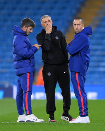 MANCHESTER, ENGLAND - OCTOBER 14: Paris Saint-Germain Manager Luis Enrique with his coaching staff during the UEFA Champions League 2026 27 League Phase MD2 match between Manchester City and Paris Saint-Germain at City of Manchester Stadium on October 14, 2026 in Manchester, England. Copyright: xMBxMediax