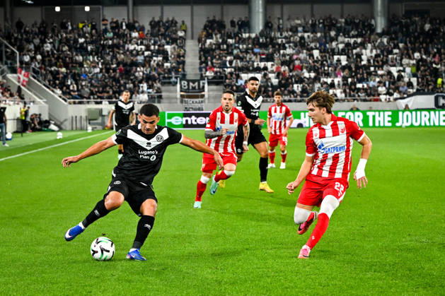 LUGANO, SWITZERLAND - OCTOBER 15: Bekhruz Karimov of FC Lugano in action against Vasilije Kostov of FK Crvena Zvezda during the UEFA Conference League 2026 27 League Phase MD1 match between FC Lugano and FK Crvena Zvezda at Lugano Arena on October 15, 2026 in Lugano, Switzerland. Lugano Lugano Arena Ticino Switzerland Copyright: xJustPictures.ch AndreaxBrancax jp-en-EuSpIm-AB_15102026_6512