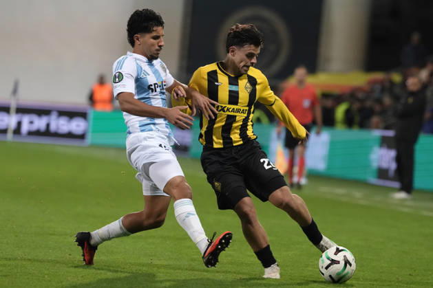 Gustavo Mendonca of Kairat and Salah Oulad M Hand of Riga FC compete for the ball during a UEFA Conference League soccer match between Latvia™s Riga FC and Kazakhstan™s Kairat Almaty at Skonto Stadium in Riga, Latvia, Thursday, Oct. 15, 2026. Riga Latvia Copyright: xRomanxKoksarovx RKV02334.JPG