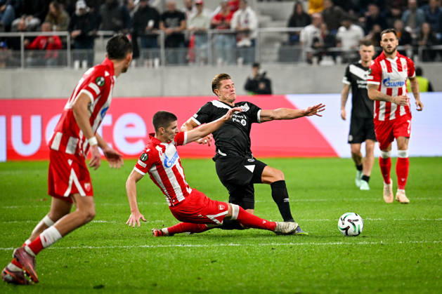 LUGANO, SWITZERLAND - OCTOBER 15: Stefan Gudelj of FK Crvena Zvezda and Kevin Behrens of FC Lugano battle for the ball during the UEFA Conference League 2026 27 League Phase MD1 match between FC Lugano and FK Crvena Zvezda at Lugano Arena on October 15, 2026 in Lugano, Switzerland. Lugano Lugano Arena Ticino Switzerland Copyright: xJustPictures.ch AndreaxBrancax jp-en-EuSpIm-AB_15102026_4578