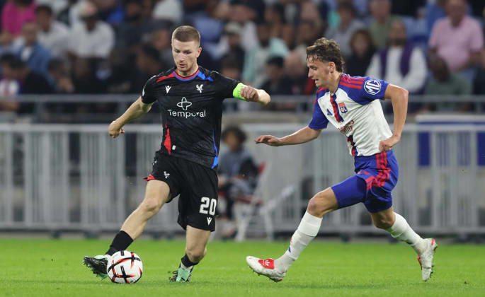 DECINES-CHARPIEU, FRANCE, OCTOBER 15: Adam Wharton of Crystal Palace FC controls the ball under pressure from Tyler Morton of Olympique Lyonnais during the UEFA Europa League 2026 27 League Phase MD2 match between Olympique Lyonnais and Crystal Palace FC at OL Stadium on October 15, 2026 in Decines-Charpieu, France (Photo by Daniel Weir Sports Press Photo SPP) Copyright: xSportsxPressxPhotox Sportspressphoto_SPR257162