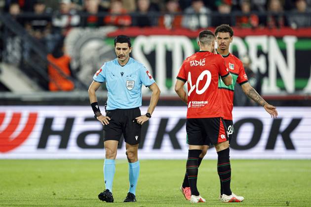 NIJMEGEN - (lr) Referee Aliyar Aghayev listens to the VAR during the Europa League match between NEC and PFC Levski Sofia at De Goffert on October 15, 2026 in Nijmegen, the Netherlands. BART STOUTJESDIJK ANP xVIxANPxSportx xxANPxIVx 572552743 originalFilename: 572552743.jpg