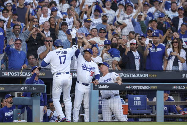 MLB, Baseball Herren, USA Postseason: NLCS Game 4 - Los Angeles Dodgers vs Milwaukee Brewers Los Angeles Dodgers designated hitter Shohei Ohtani (L) shakes hands with teammate Andy Pages after hitting a home run during Game 4 of the National League Championship Series between the Los Angeles Dodgers and the Milwaukee Brewers at Dodger Stadium in Los Angeles, California, USA, 15 October 2026. LOS ANGELES CALIFORNIA UNITED STATES  Copyright: xCHRISxTORRESx