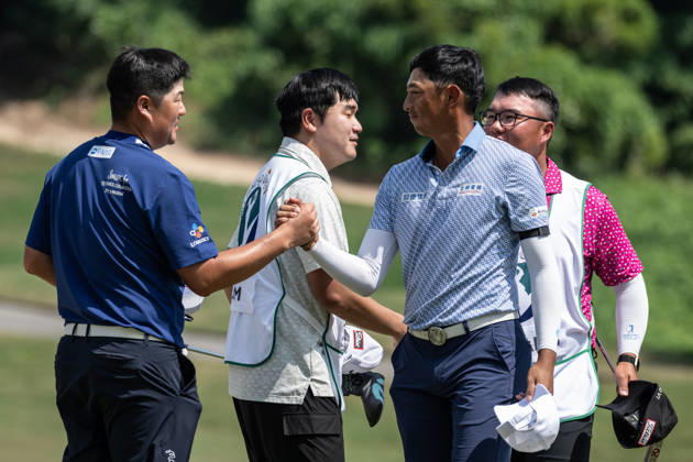 October 16, 2026, Coloane, Macao Sar, China: Sungjae IM from Korea (L) is congratulated on coming in -13 par by WANG Wei-hsuan from Taiwan(R) finishes -10par to rank 2nd.Round 2 in the Macao Open Golf at Macau Golf & Country Club. Macau Open Golf Round 2  - ZUMAr144 20261016_zap_r144_084 Copyright: xJaynexRussellx