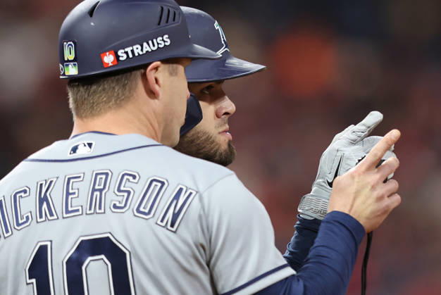 Tampa Bay Rays Jonathan Aranda (8) talks to first base coach Corey Dickerson (10) after walking against the Cleveland Guardians in the sixth inning during game four of the MLB, Baseball Herren, USA American League Championship Series at Progressive Field in Cleveland, Ohio, on Saturday, October 17, 2026.  CLE20261017720 AARONxJOSEFCZYK