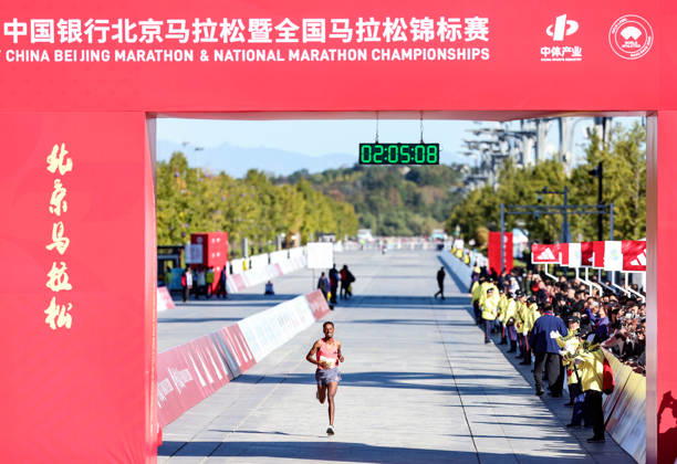 (261018) -- BEIJING, Oct. 18, 2026 -- Adane Kebede Gebre of Ethiopia sprints to the finish line to win the third place of the men s marathon event during the 2026 Beijing Marathon & National Marathon Championships in Beijing, capital of China, Oct. 18, 2026. ) (SP)CHINA-BEIJING-2026 BEIJING MARATHON(CN) LuoxYuan 