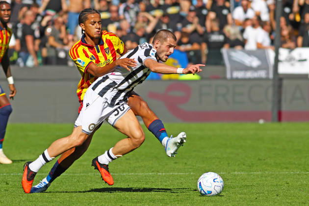 Lecce’s oumar ngom fights for the ball with Udinese s Giorgi chakvetadze during the Serie A soccer match between Udinese and Lecce at the Friuli Stadium in Udine, north east Italy - October 18, 2026. - Soccer  Copyright: xAndreaxBressanutti LaPressex