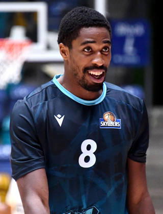 18.10.2026, xokbx, Basketball BBL Pokal, Frankfurt Skyliners - VET-Concept Gladiators Trier v.l. William Christmas (Fraport Skyliners Frankfurt), Mimik, Gestik, Emotion, lacht, zufrieden Frankfurt am Main