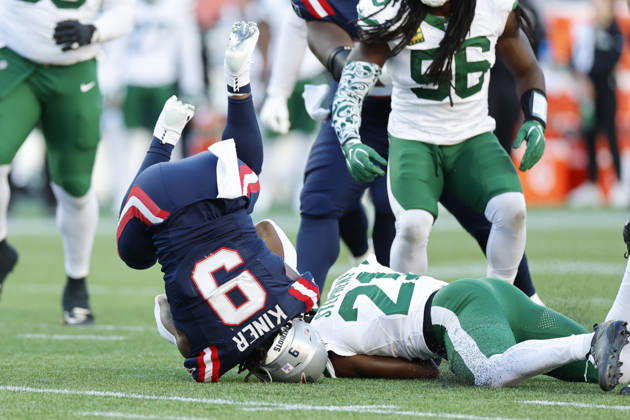 New England Patriots running back Corey Kiner is tackled by New York Jets cornerback Brandon Stephens, right, during the second half at Gillette Stadium in Foxborough, Massachusetts on Sunday, October 18, 2026.  BOP20261018012 CJxGUNTHER