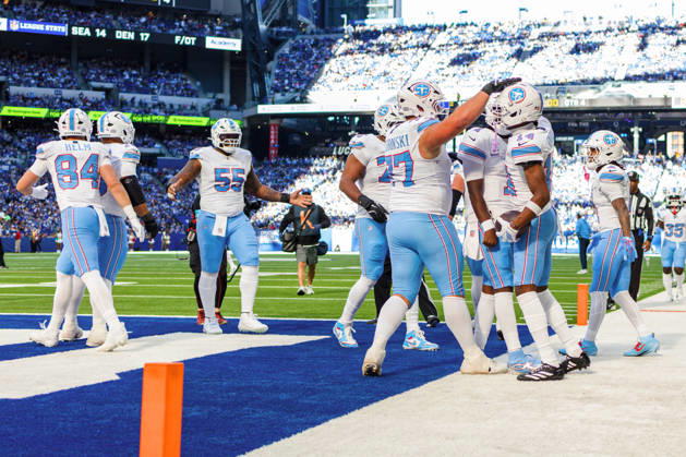 Oct 18, 2026; Indianapolis, IN, USA; Tennessee Titans wide receiver Carnell Tate (14) celebrates touchdown with his teammates during NFL, American Football Herren, USA game action against the Indianapolis Colts at Lucas Oil Stadium. Mandatory Credit: -Cal Media Indianapolis USA - ZUMAc04_ 20261018_zma_c04_024 Copyright: xJohnxMersitsx