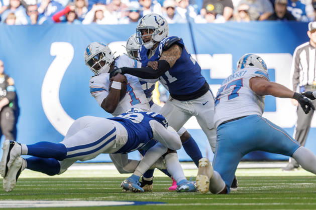 October 18, 2026, Indianapolis, Indiana, U.S: Tennessee Titans quarterback Cam Ward (1) is tackled by Indianapolis Colts defensive lineman DeForest Buckner (99) and Indianapolis Colts defensive lineman Laiatu Latu (97) on a run during the game between the Tennessee Titans and the Indianapolis Colts at Lucas Oil Stadium, Indianapolis, Indiana. NFL, American Football Herren, USA 2026 Titans 26-20 Colts  - ZUMAs304 20261018_zaf_s304_053 Copyright: xScottxStuartx