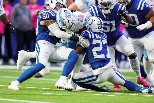Oct 18, 2026; Indianapolis, IN, USA; Tennessee Titans running back Tony Pollard (20) runs with the ball as Indianapolis Colts cornerback Justin Walley (27) attempts to make the tackle during NFL, American Football Herren, USA game action at Lucas Oil Stadium. Mandatory Credit: -Cal Media NFL 2026: Titans Vs Colts OCT 18  - ZUMAc04_ 20261018_zma_c04_328 Copyright: xJohnxMersitsx