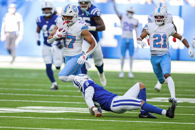 Oct 18, 2026; Indianapolis, IN, USA; Tennessee Titans wide receiver Chimere Dike (17) returns punt as Indianapolis Colts punter Rigoberto Sanchez (8) defends during NFL, American Football Herren, USA game action at Lucas Oil Stadium. Mandatory Credit: -Cal Media NFL 2026: Titans Vs Colts OCT 18  - ZUMAc04_ 20261018_zma_c04_333 Copyright: xJohnxMersitsx
