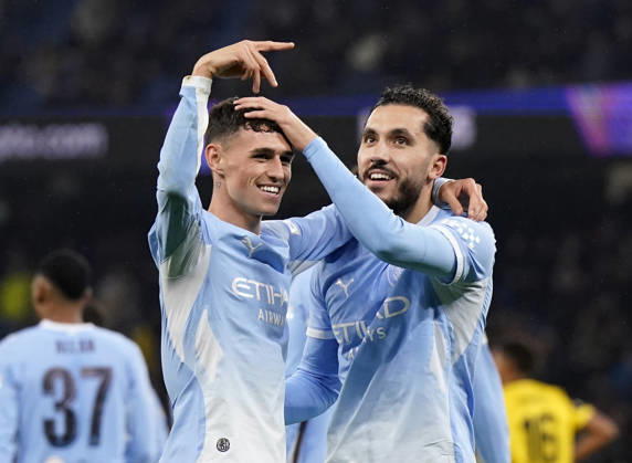 Manchester, England, 20th October 2026. Rayan Cherki of Manchester City (r) celebrates scoring their third goal (3-1) during the Manchester City vs AEK Athens UEFA Champions League match at the Etihad Stadium, Manchester. Picture credit should read: Andrew Yates Sportimage EDITORIAL USE ONLY. No use with unauthorised audio, video, data, fixture lists, club league logos or live services. Online in-match use limited to 120 images, no video emulation. No use in betting, games or single club league player publications. SPI_044_AY_ManCity__Athens SPI-5090-0043
