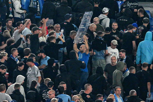 SOCCER - UEFA Champions League - AS Roma vs. Slovan Bratislava Photo by IPA ABACAPRESS.COM89965288 - Clashes between fans in the stands during the UEFA Champions League soccer match between Roma and Slovan Bratislava at the Olimpico Stadium on October 20, 2026, in Rome, Lazio. During the AS Roma vs. Slovan Bratislava UEFA Champions League soccer match in Rome, Italy, on October 20, 2026 Rome Italy  Copyright: xIPAxSport ABACAx