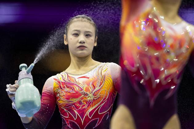 ROTTERDAM - Chinese gymnasts during the team final at the World Gymnastics Championships in Rotterdam Ahoy. IRIS VAN DEN BROEK ANP xVIxANPxSportx xxANPxIVx 573182606 originalFilename: 573182606.jpg