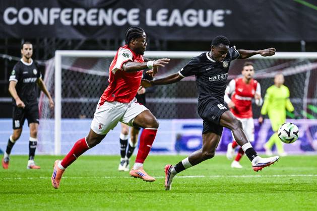 Bright Arrey-Mbi of SC Braga and Hyllarion Goore of KAA Gent pictured in action during a soccer game between Portuguese SC Braga and Belgian soccer team KAA Gent, Thursday 22 October 2026 in Braga, Portugal, the second match in the UEFA Conference League league phase. TOM GOYVAERTS TomxGoyvaerts  x190689118x