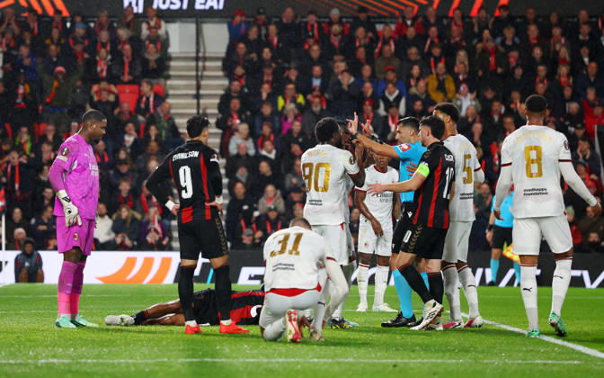 Bournemouth, England, 22nd October 2026. Referee Vassilis Fotias brandishes a red card to Mike Maignan of AC Milan after he pushed Tyler Adams of Bournemouth in the face during the AFC Bournemouth vs AC Milan UEFA Europa League match at the Vitality Stadium, Bournemouth. Picture credit should read: Paul Terry Sportimage EDITORIAL USE ONLY. No use with unauthorised audio, video, data, fixture lists, club league logos or live services. Online in-match use limited to 120 images, no video emulation. No use in betting, games or single club league player publications. SPI_040_PT_Bournmouthmouth_AC_Milan SPI-5092-0040