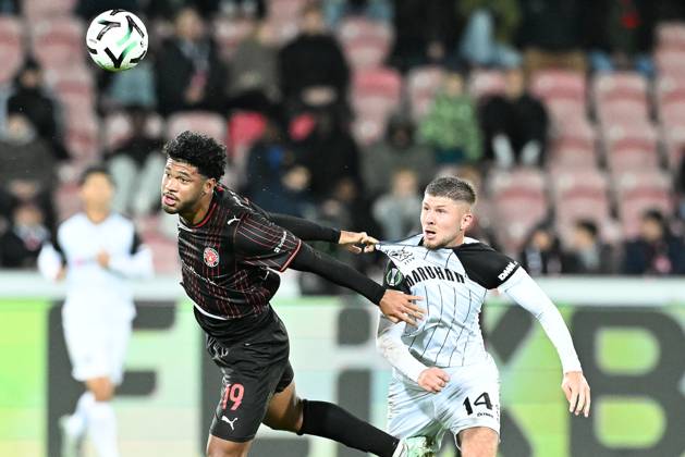 Midtjylland s Pedro Bravo and STVV s Ryan Merlen pictured in action during a soccer game between Danish FC Midtjylland and Belgian Sint-Truidense VV, Thursday 22 October 2026 in Herning, Denmark, on the second day of the UEFA Conference League league phase. JILLxDELSAUX  x190692015x