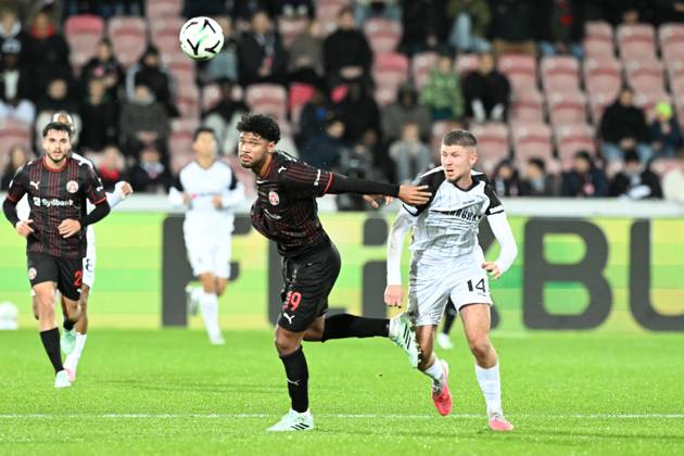 Midtjylland s Pedro Bravo and STVV s Ryan Merlen pictured in action during a soccer game between Danish FC Midtjylland and Belgian Sint-Truidense VV, Thursday 22 October 2026 in Herning, Denmark, on the second day of the UEFA Conference League league phase. JILLxDELSAUX  x190692047x