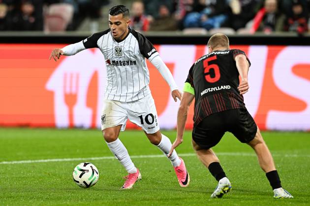 STVV s Ilias Sebaoui and Midtjylland s Rasmus Kristensen pictured in action during a soccer game between Danish FC Midtjylland and Belgian Sint-Truidense VV, Thursday 22 October 2026 in Herning, Denmark, on the second day of the UEFA Conference League league phase. JILLxDELSAUX  x190692109x