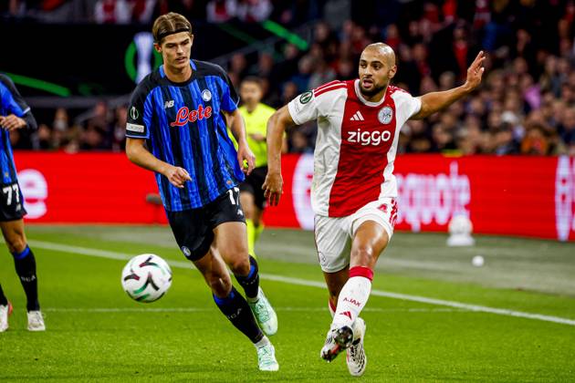 AMSTERDAM - Sofyan Amrabat of AFC Ajax passes the ball under pressure from Charles De Ketelaere of Atalanta BC during the UEFA Conference League match between AFC Ajax and Atalanta BC at the Johan Cruijff ArenA on October 22, 2026 in Amsterdam, the Netherlands. WART BRINKERHOF ANP Conference League 2026 27 xVIxANPxSportx xMarcelxterxBalsxIVx 573299784 originalFilename: 573299784.jpg