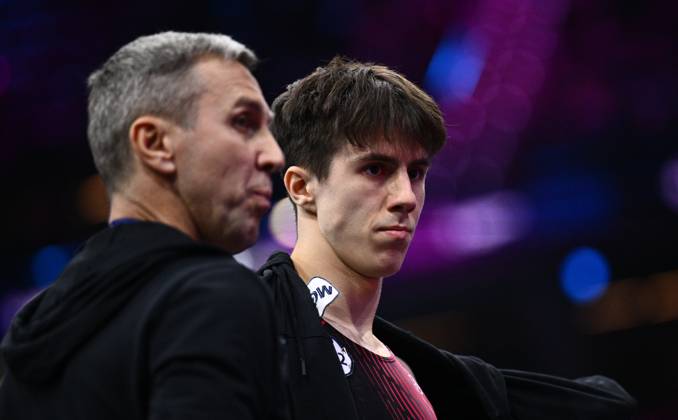 Netherlands Artistic Gymnastics World Championships 9271023 22.10.2026 Arsenii Dukhno of Team World Gymnastics Neutral Athletes 2 and his father and coach, Andrei Dukhno, are seen during the men s all-around final at the 2026 World Artistic Gymnastics Championships in Rotterdam, the Netherlands. Alexey Filippov Sputnik Rotterdam Netherlands  Copyright: xAlexeyxFilippovx