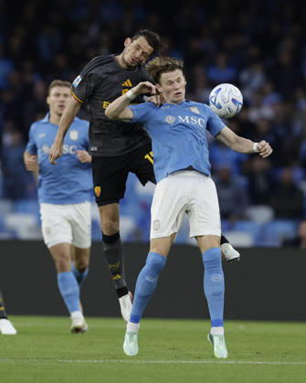 Italy: Serie a football match SSC Napoli vs AS Roma Roma™s Dutch midfielder Marten de Roon challenges for the ball with Napoli s Scottish midfielder Scott McTominay during the Serie A football match between SSC Napoli and AS Roma at the Diego Armando Maradona Stadium in Naples, October 24, 2026. _BPH5068 Copyright: xAntonioxBalascox