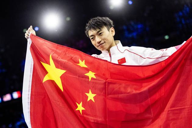 ROTTERDAM - Jingyuan Zou (CHN) reacts after winning the parallel bars apparatus final at the World Gymnastics Championships in Rotterdam Ahoy. IRIS VAN DEN BROEK ANP xVIxANPxSportx xxANPxIVx 573616515 originalFilename: 573616515.jpg