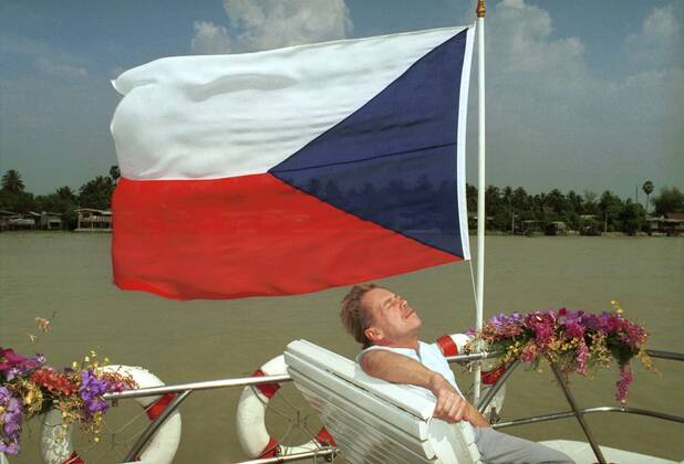 Czech President Vaclav Havel takes a rest below Czech national flag at a river cruising boat during his official visit to Thailand on February 11, 1994. CTK Photo Igor Zehl  CTKPhoto00081709