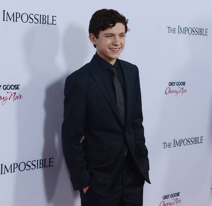 English actor Tom Holland, a cast member in the dramatic thriller motion picture The Impossible , attends the premiere of the film at the ArcLight Cinerama Dome in the Hollywood section of Los Angeles on December 10, 2012. The film is based on the Phuket, Thailand 2004 Tsunami account of a family caught, with tens of thousands of strangers, in the mayhem of one of the worst natural catastrophes of our time.  LAP2012121024