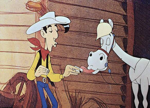 Lucky Luke, Jolly Jumper Gemeinsam mit seinem treuen Pferd Jolly Jumper gelingt es Lucky Luke, die gefuerchteten Dalton-Brueder aus der Stadt zu jagen. 1971 UnitedArchives01352673