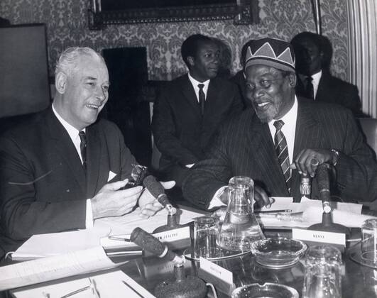 Jul 08, 1964 - London, England, United Kingdom - KEITH HOLYOAKE (L), Prime Minister of New Zealand, seen in conversation with JOMO KENYATTA, Prime Minister of Kenya, at the opening of the Commonwealth Prime Minister s Conference at Marlborough House.. London United Kingdom - ZUMAk09