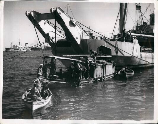 Nov. 11, 1956 - The Middle East Crisis...Naval Drivers at work clearing the canal Block ships: Photo Shows A Navy diver from one of the salvage vessels goes down to start work on clearing the sunken block ships in the Suez Canal.  - ZUMAk09
