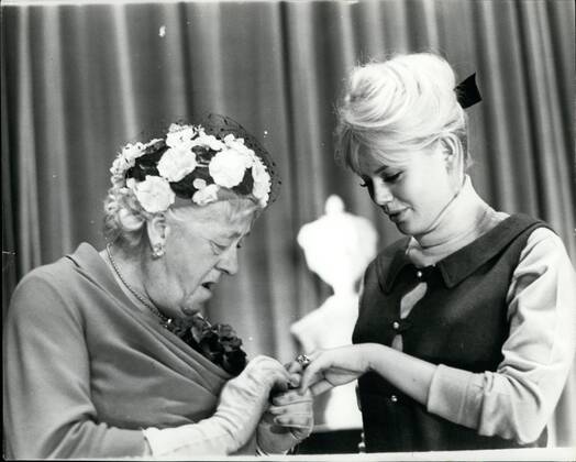 Feb. 02, 1964 - Margaret Rutherford sees the new wedding ring.: there was a lonely girl among the stars attending yesterday s rehearsal of the Royal Film Performance comedy Move over darling . She was the new Mrs. Peter Sellers - Swedish actress Britt Eklund, and she was lonely because Peter. who she married last week, has had to go to Hollywood to make a Film. Photo shows Veteran actress Margaret Rutherford, who appears in the film, look at the weeding and engagement rings of Britt Eklund. - ZUMAk09