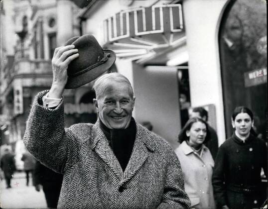 Feb. 02, 1968 - Maurice Chevailer here for farewell concert tour he joins the queue to see the film Camelot : Maurice Chvealier, the most durable entertainer, and the most popular Frenchman in the world, has arrived in London, Now nearly 80, he is here to make a farewell tour of Britain doing a series of one-man concerts, all one -night stands, starting in Manchester on Feb. 13th, and coming to the London Palladium on Sunday Feb 18th. This afternoon Maurice went along to the Warner Cinema to see the film Camelot . Photo shows Maurice Chevalier, doffs his hat as he walks through Leicester Square on his way to see the film Camelot at the Warner Cinema this afternoon. - ZUMAk09