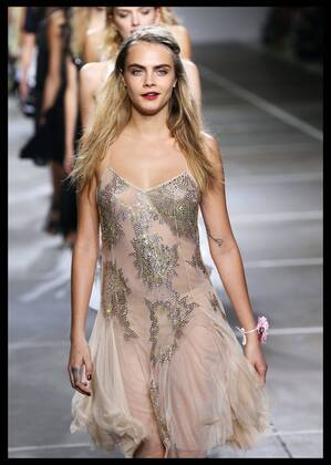 . 14 09 2014. London, United Kingdom. Cara Delevingne closes the Topshop Unique show at London Fashion Week for Spring Summer 2015. xStephenxLockx xi-Imagesx IIM-2962-0001