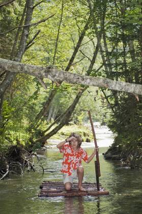 Austria, Salzburger Land, Boy on timber raft, watching out model released  HHF02910