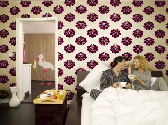 Young couple having breakfast in Bed model released property released WESTF06682
