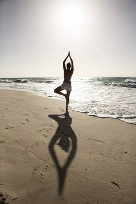Caribbean, Barbados, Silver Sands beach, woman practicing yoga model released Symbolfoto  SKF001563