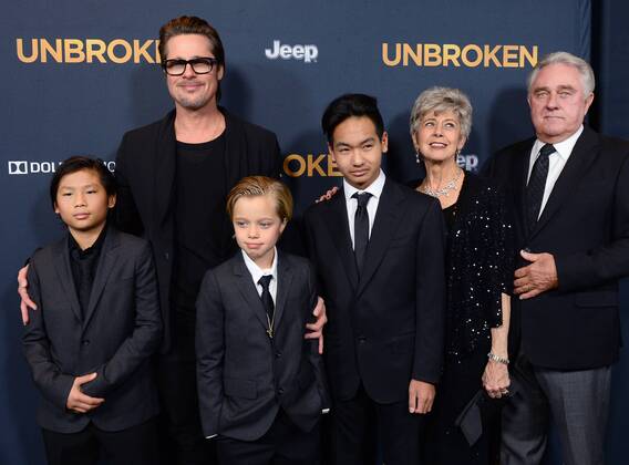 Actor Brad Pitt attends the premiere of the biographical motion picture war drama Unbroken with his children Pax Thien Jolie-Pitt, Shiloh Nouvel Jolie-Pitt,, Maddox Jolie-Pitt (L-R) and his mother Jane Pitt, and father William Pitt at the Dolby Theatre Theatre in the Hollywood section of Los Angeles on December 15, 2014.  LAP2014121501