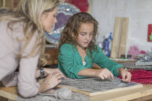 Mother and daughter doing crafts in home garage model released Symbolfoto property released  ZEF004867