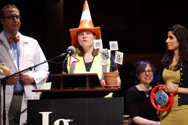 Helen F. Ashdown (C) of University of Oxford accepts her team s 2015 Ig Nobel Prize in Diagnostic Medicine for their work in determining that acute appendicitis can be accurately diagnosed by the amount of pain evident when the patient is driven over speed bumps, at the awards ceremony at Harvard University in Cambridge, Massachusetts on September 17, 2015. The prizes which are awarded by the Annals of Improbable Research are intended to celebrate the unusual, honor the imaginative and spur people s interest in science, medicine, and technology.  BOS2015091714 MATTHEWxHEALEY