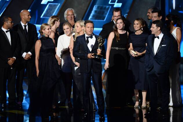 Producer Mark Burnett (C) with crew members accept the award for Outstanding Reality-Competition Program for The Voice onstage during the 67th Primetime Emmy Awards in the Microsoft Theater in Los Angeles on September 20, 2015.  LAP20150920711 KENxMATSUI