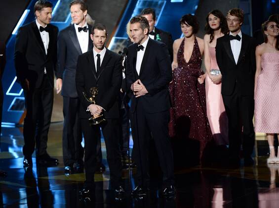 Writer producers David Benioff and D.B. Weiss (C) with cast and crew accept the award for Outstanding Drama Series for Game of Thrones onstage during the 67th Primetime Emmy Awards in the Microsoft Theater in Los Angeles on September 20, 2015.  LAP20150920785 KENxMATSUI